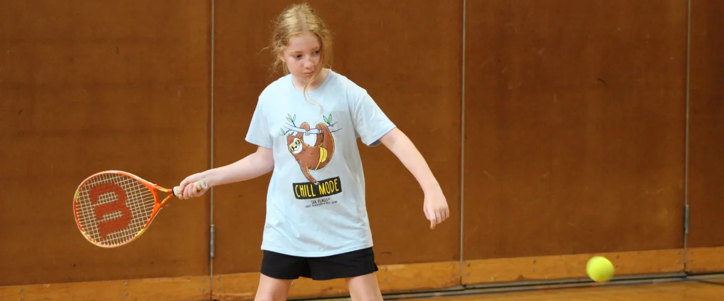 Camper playing tennis