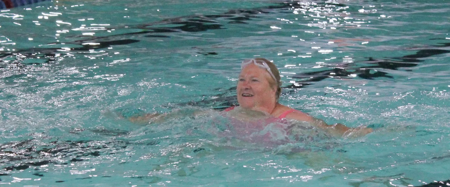 Woman participating in an water fitness class