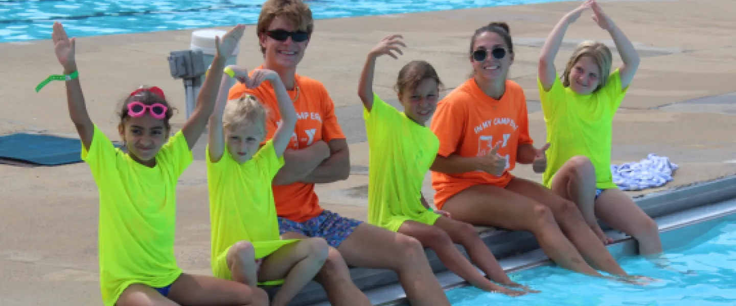 Pioneer Campers holding up the YMCA