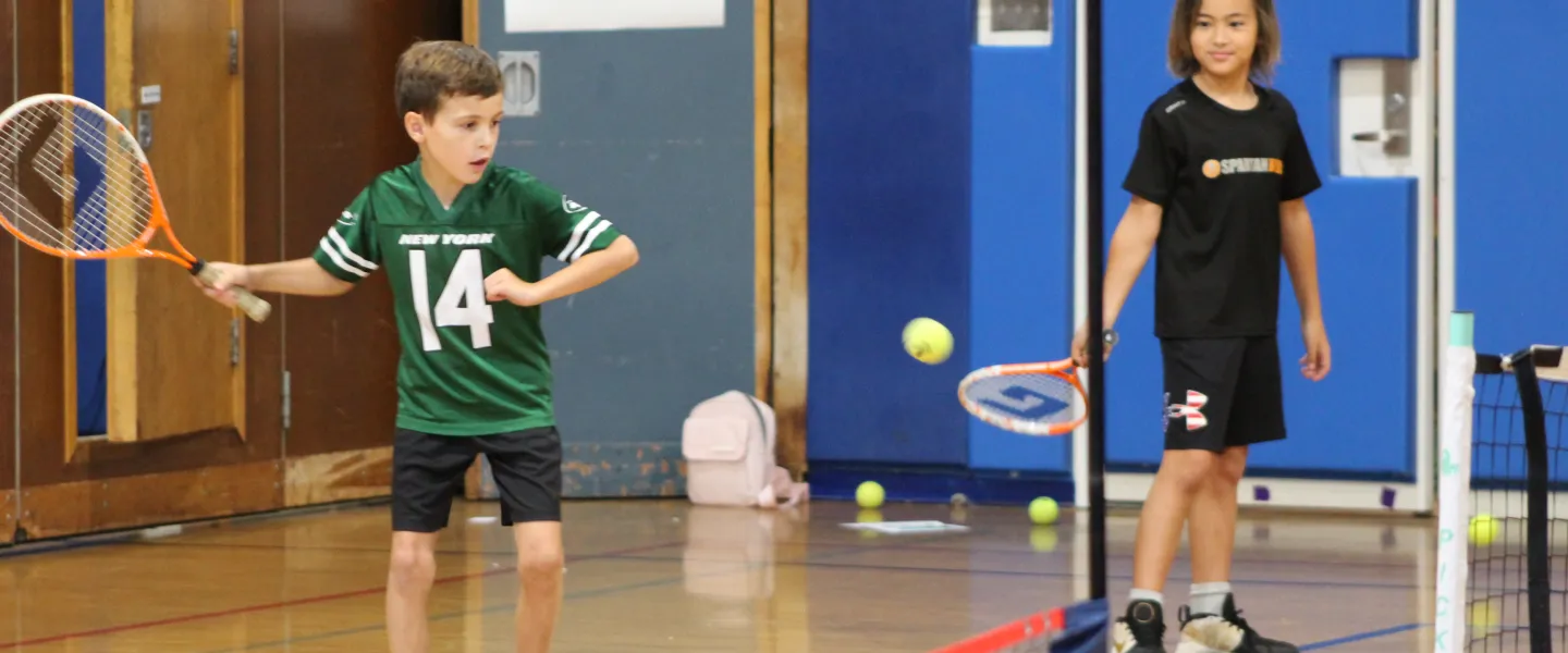 Sports Campers Playing Tennis