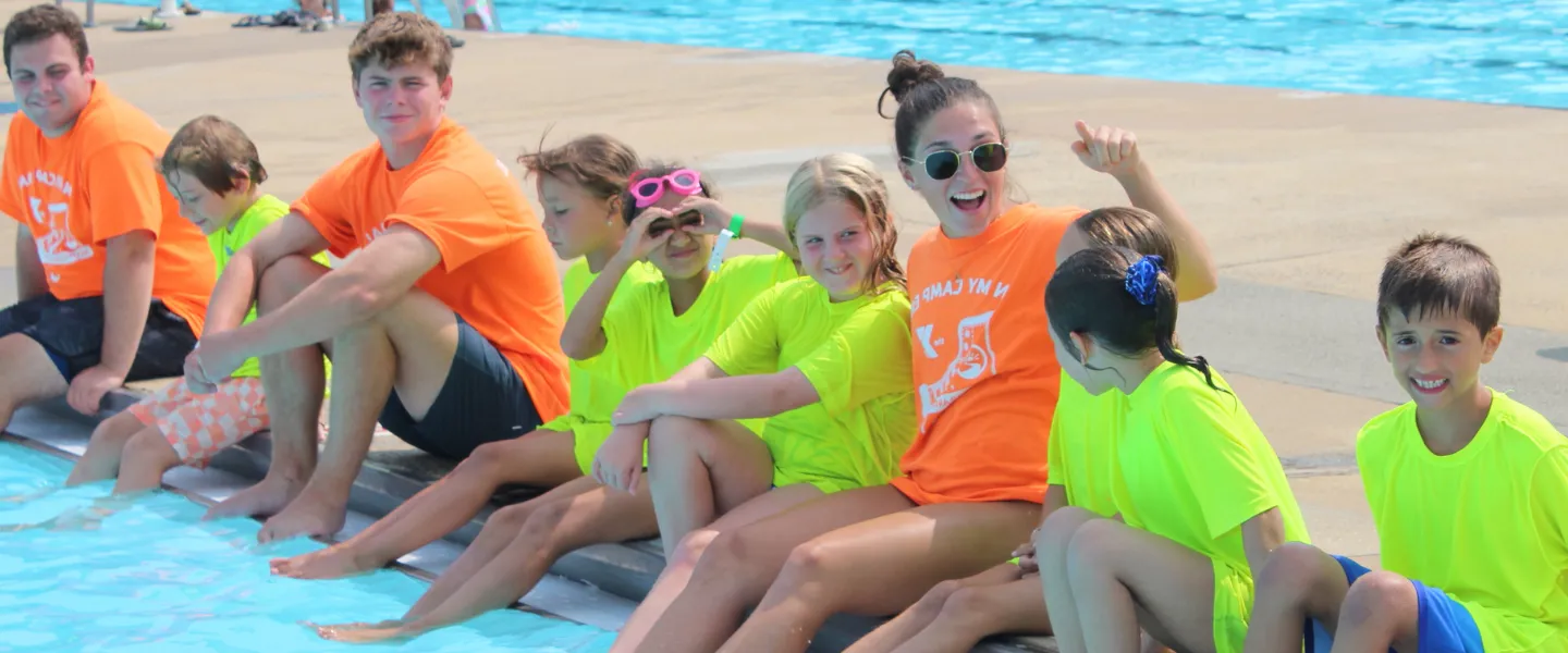 Pioneer campers and counselors at the outdoor pool