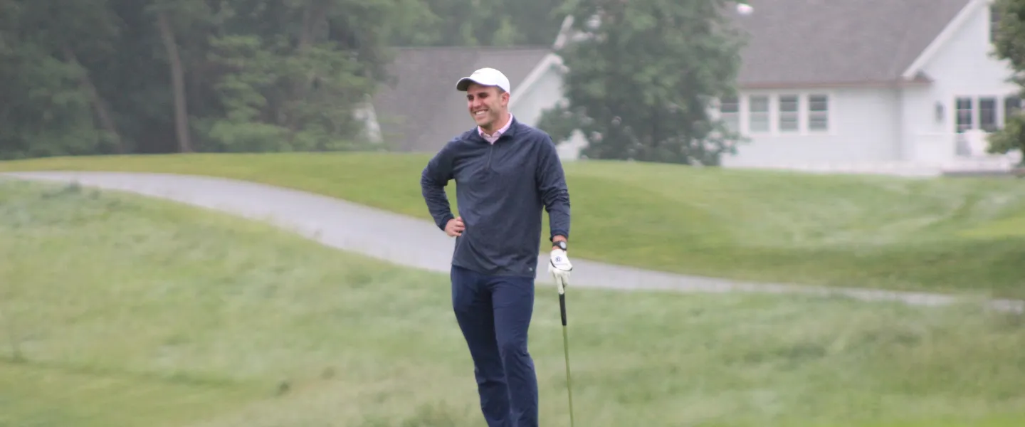 golfer smiling on the green