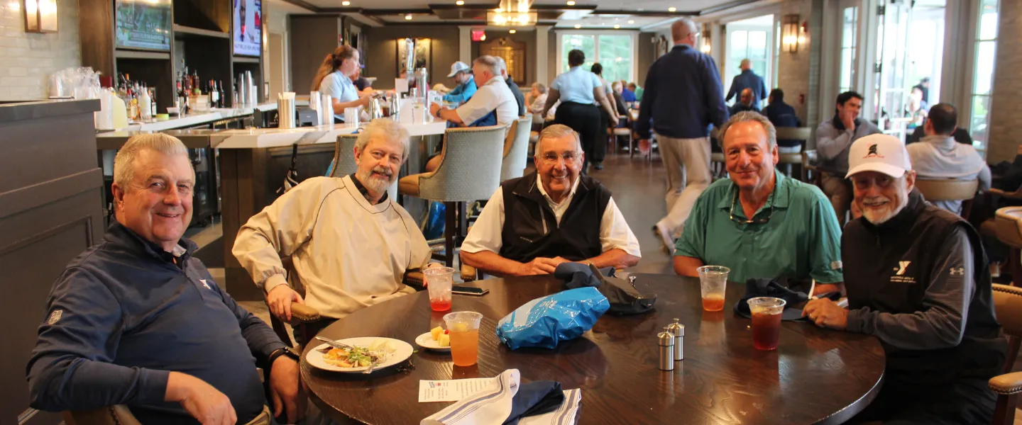 golfers at lunch before shotgun