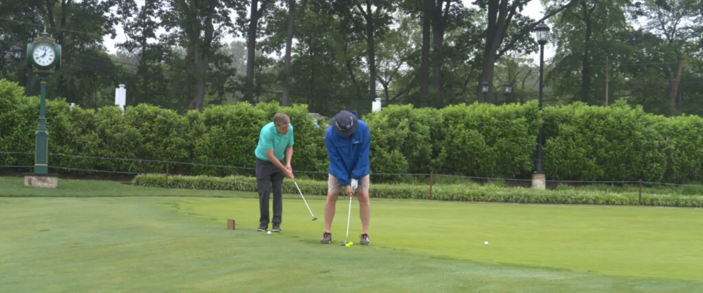 Golfers on the putting green