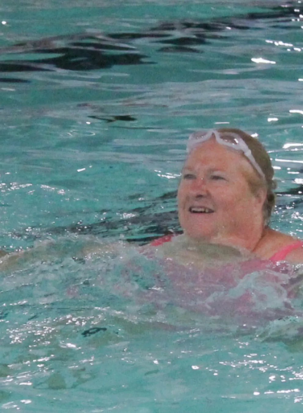 Woman participating in an water fitness class