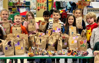 Y Kindergarteners proudly show off their 'Boo Bags' 