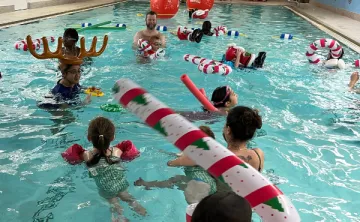 Members in Rooke Pool with Christmas Decorations